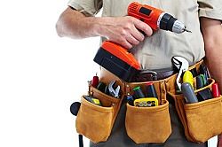 Handyman with a tool belt. Isolated on white background.